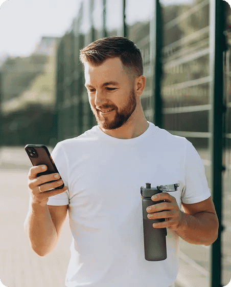 David arrives at the gym, scans in with his phone, and checks in for his training session.