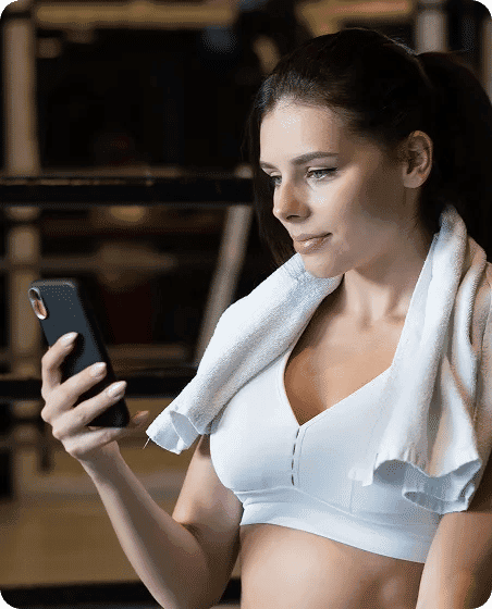 Anna finishes her Pilates class, earns loyalty points, and rates her session right from her phone.
